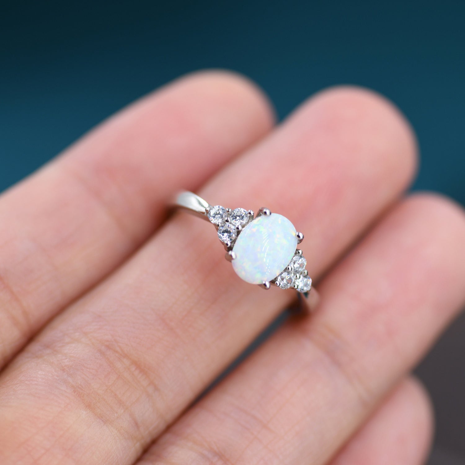 Oval Fire Opal Halo Ring with CZ Accents