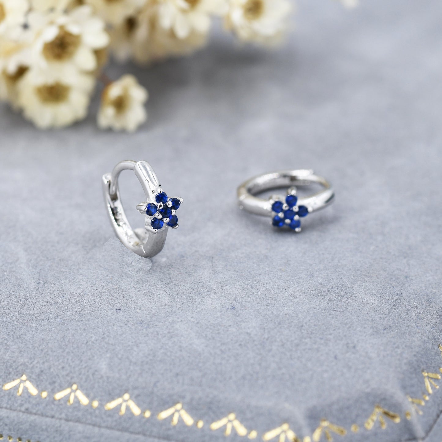 Tiny Sapphire Blue CZ Flower Huggie Hoops, CZ Hoop Earrings, Crystal Flower Huggie Earrings, September Birthstone