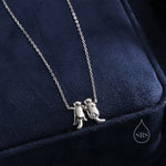 Otters Holding Hands Charm Necklace