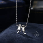 Otters Holding Hands Charm Necklace