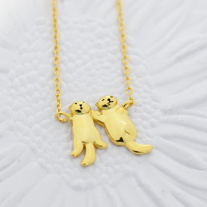 Tiny Otter Holding Hands Pendant Necklace in Sterling Silver, Silver or Gold or Rose Gold, Nature Inspired Animal Necklace