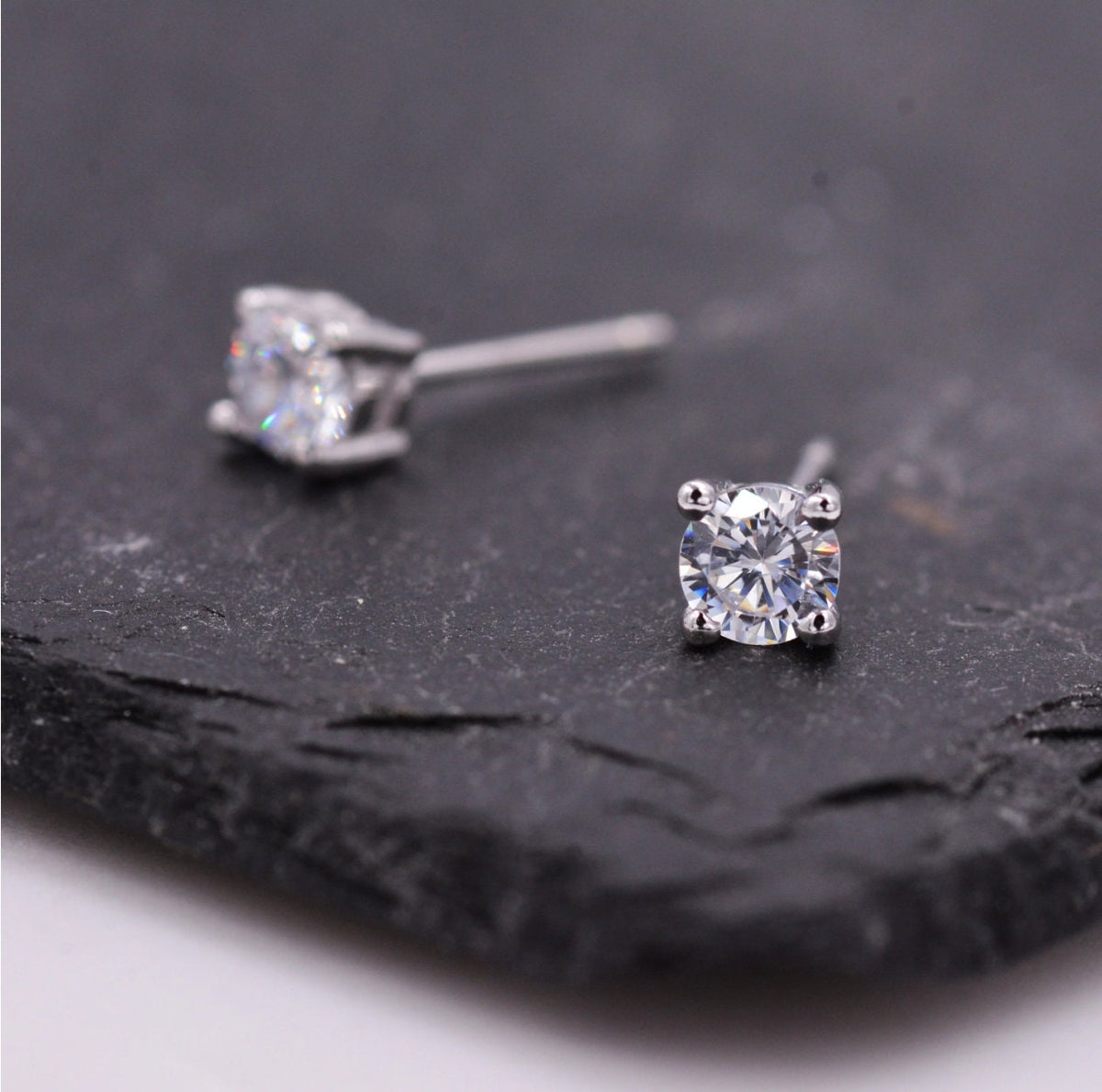 Four Prong CZ 18G Screw Back Earrings in Sterling Silver