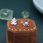 Mismatched Snail and Monstera Leaf Stud Earrings in Sterling Silver, Asymmetric Monstera Leaf and Snail Nature Inspired Animal Earrings