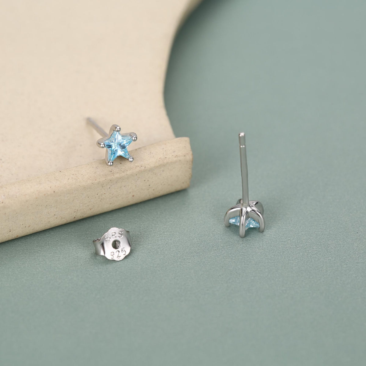 Sterling Silver 4mm Topaz Blue CZ Star Stud Earrings