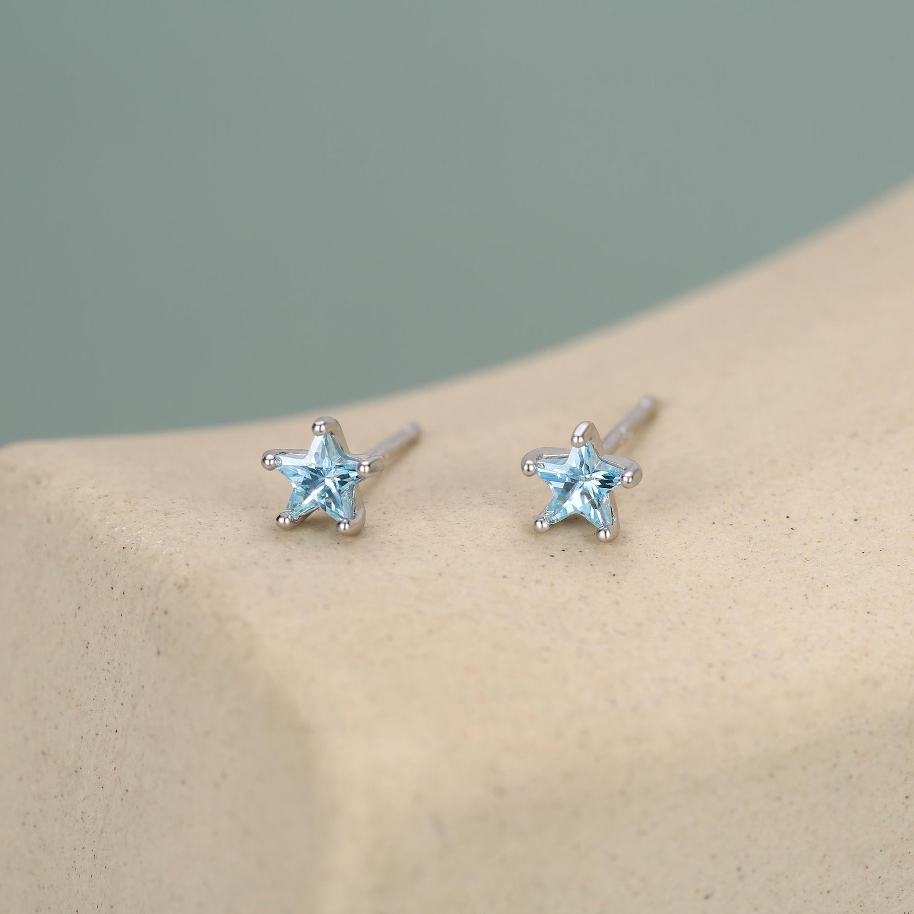 Sterling Silver 4mm Topaz Blue CZ Star Stud Earrings