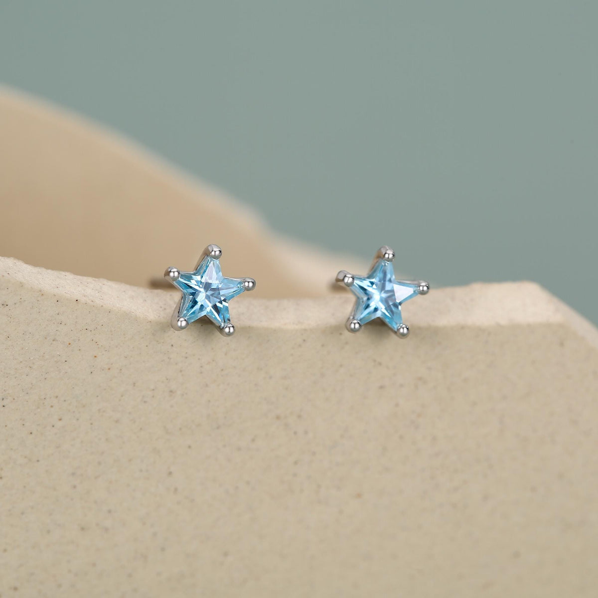 Sterling Silver 4mm Topaz Blue CZ Star Stud Earrings