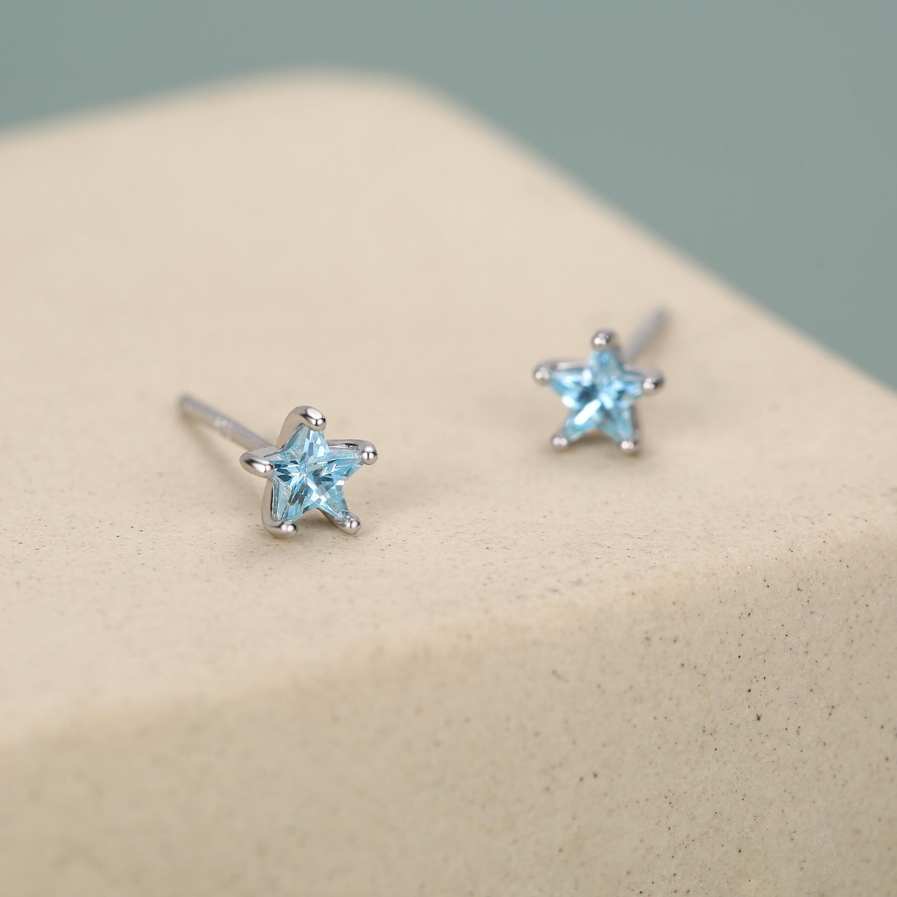 Sterling Silver 4mm Topaz Blue CZ Star Stud Earrings
