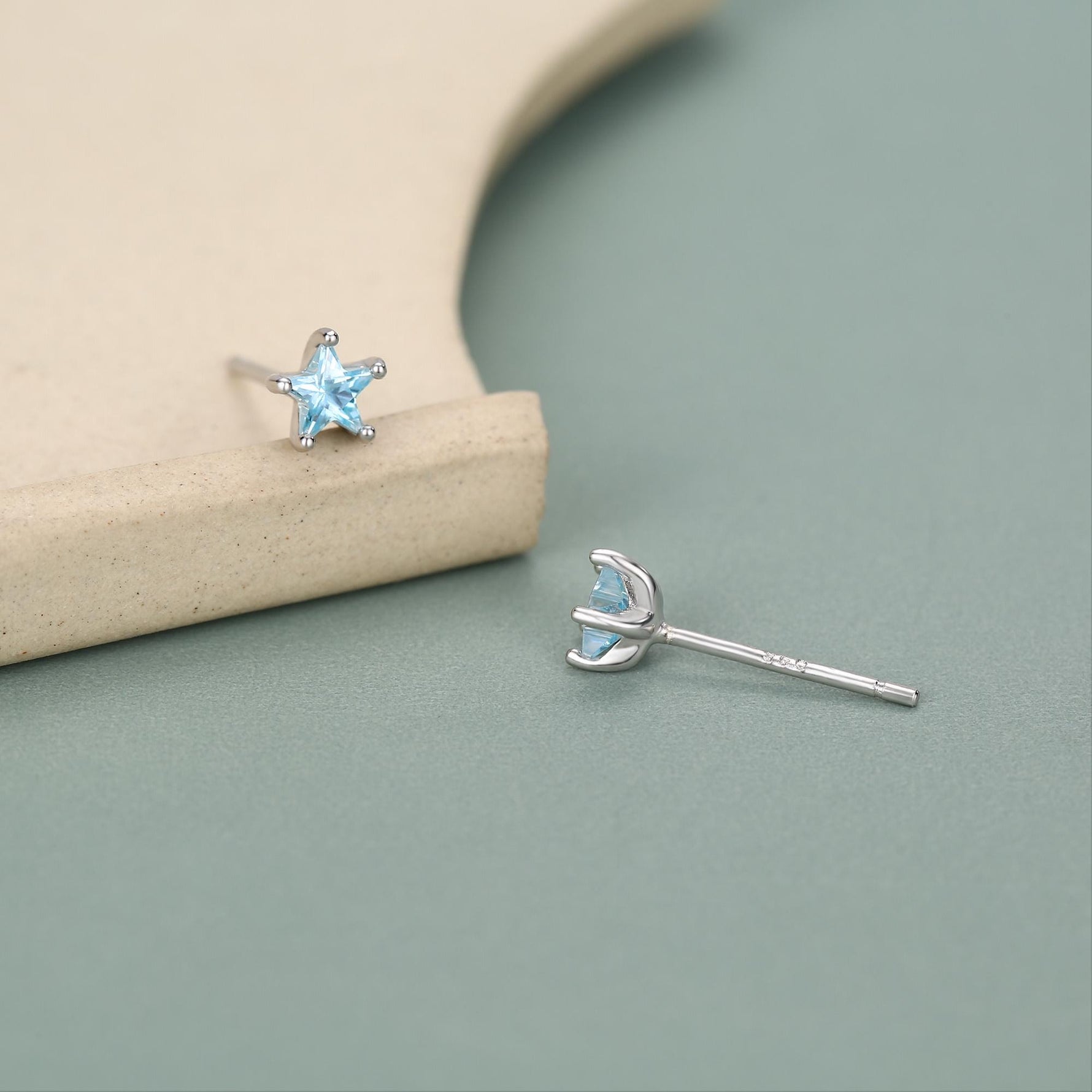 Sterling Silver 4mm Topaz Blue CZ Star Stud Earrings
