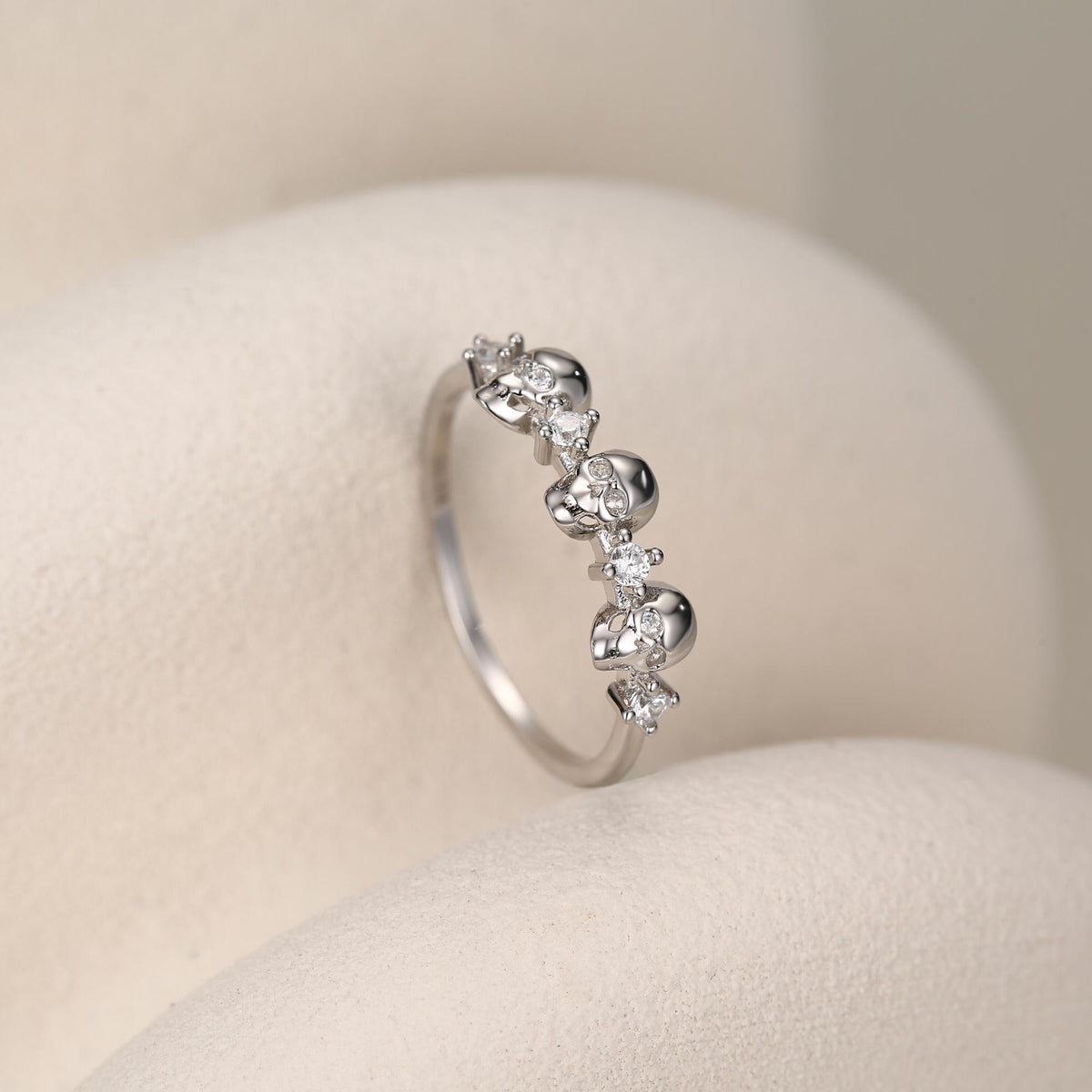 Triple Skull Motif Ring with Clear CZ