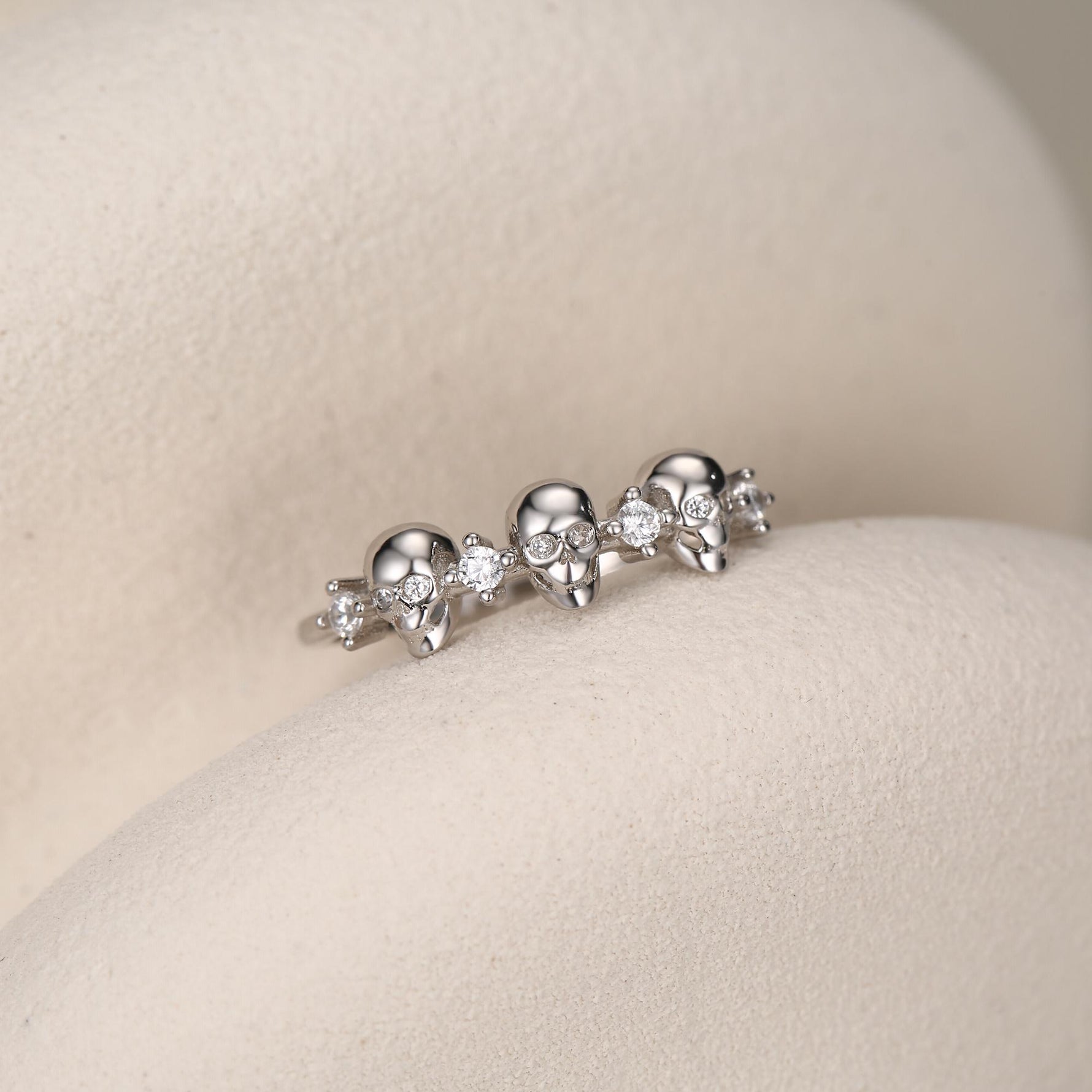 Triple Skull Motif Ring with Clear CZ