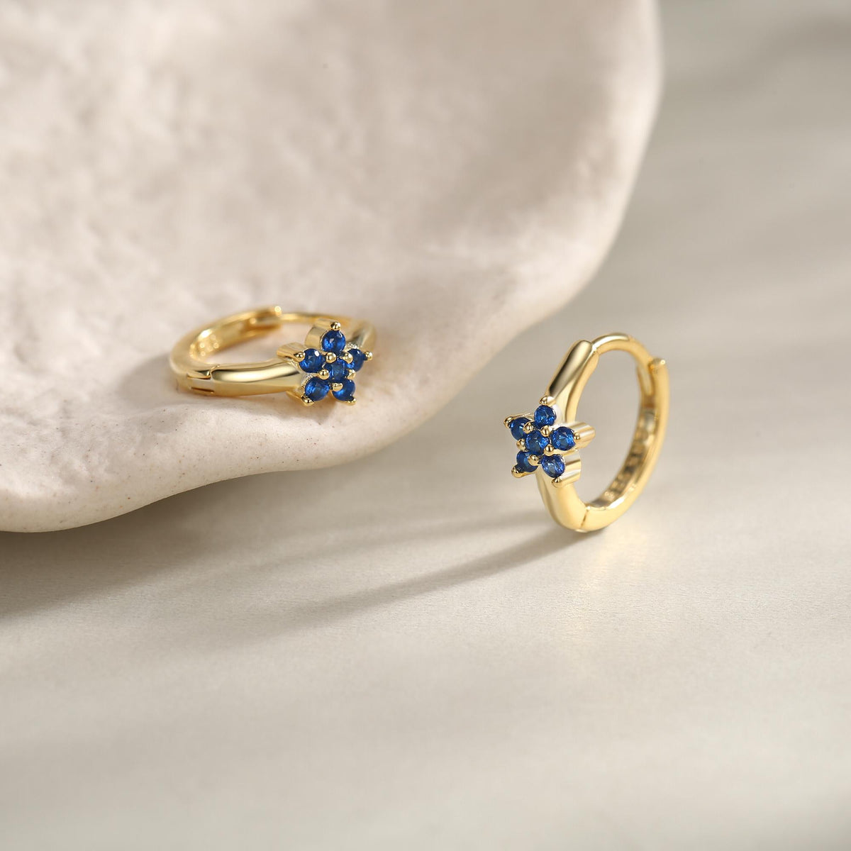 Tiny Sapphire Blue CZ Flower Huggie Hoops, CZ Hoop Earrings, Crystal Flower Huggie Earrings, September Birthstone