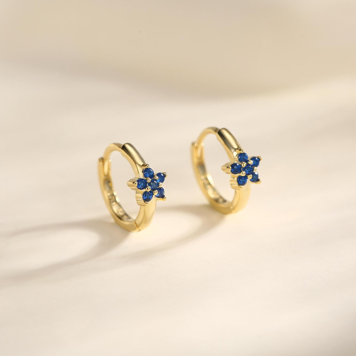 Tiny Sapphire Blue CZ Flower Huggie Hoops, CZ Hoop Earrings, Crystal Flower Huggie Earrings, September Birthstone