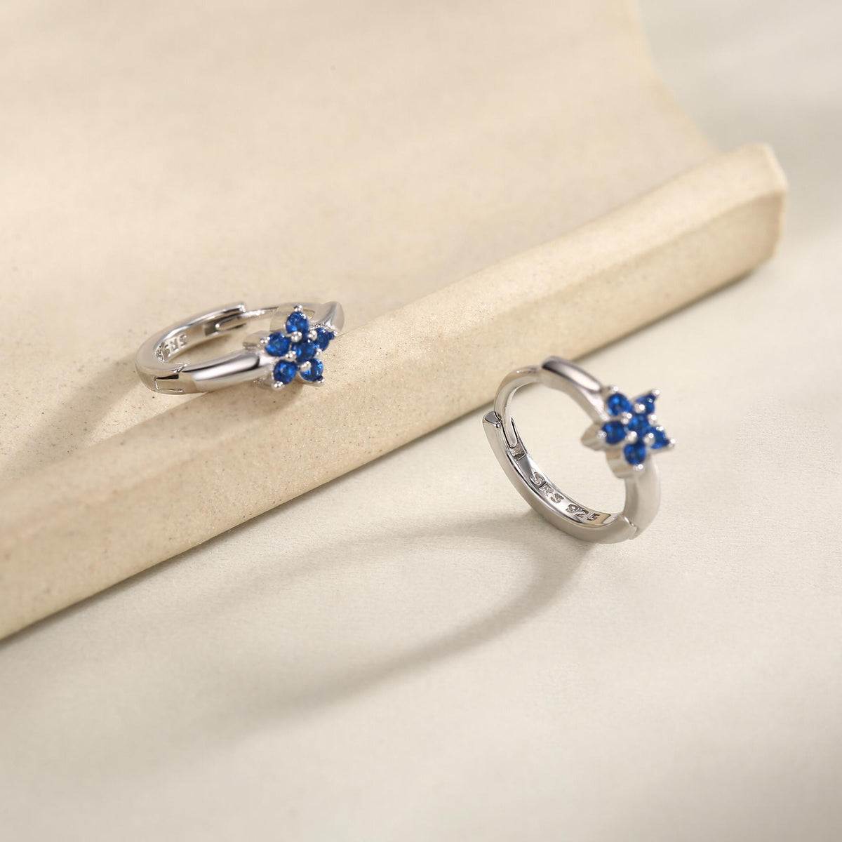 Tiny Sapphire Blue CZ Flower Huggie Hoops, CZ Hoop Earrings, Crystal Flower Huggie Earrings, September Birthstone